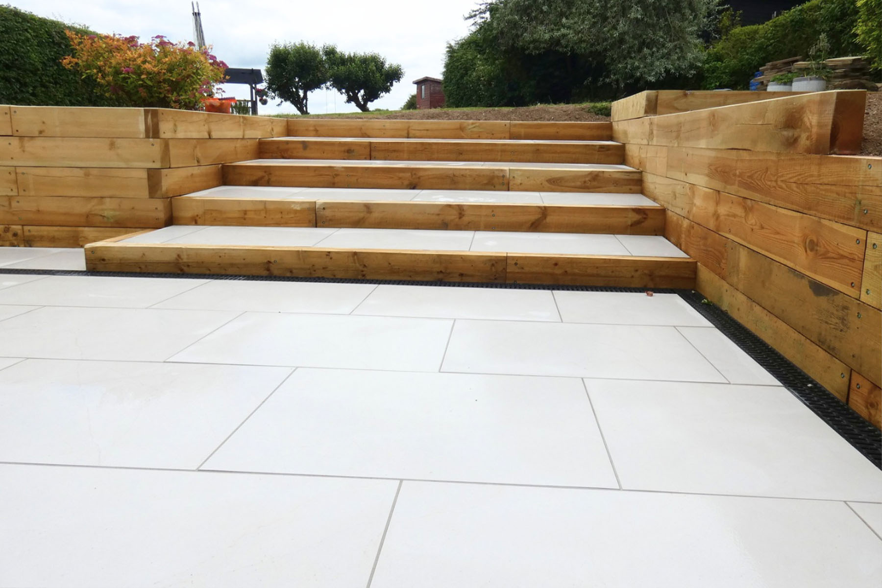 Armani White Porcelain Patio by Brick By Brick Construction & Landscape