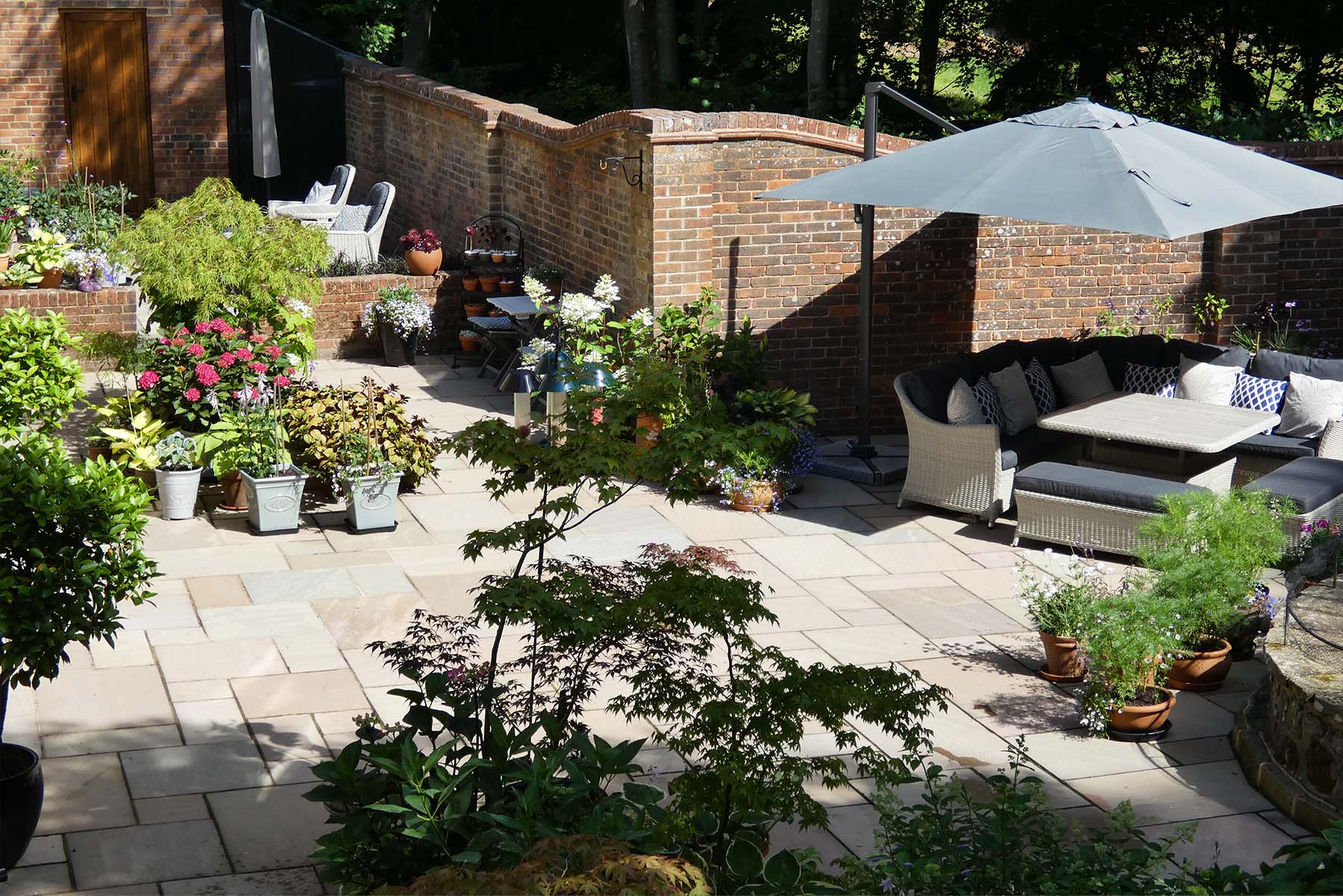 Indian Sandstone Patio in Ivy Hatch by Brick by Brick Construction & Landscape